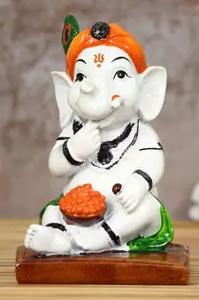eCraftIndia DECORative Lord Ganesha eating Ladoo in Lord Krishna Avatar