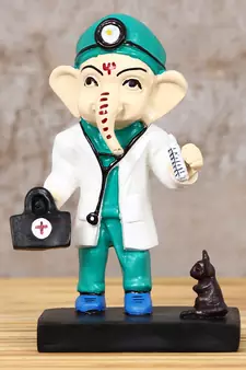 eCraftIndia DECORative Lord Ganesha Idol in Doctor Avatar
