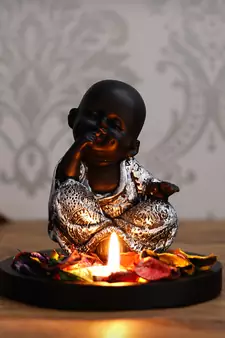 eCraftIndia DECORative Smiling Monk Silver Buddha with Wooden Base  Fragranced Petals and Tealight