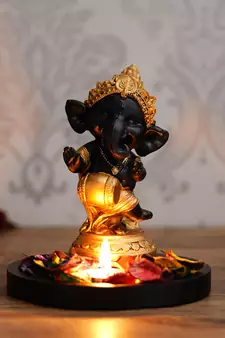 Golden and Black Lord Ganesha Dancing Avatar DECORative Showpiece with Wooden Base  Fragranced Petals and Tealight