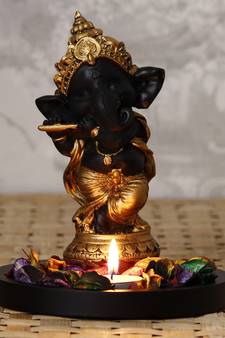 Golden and Black Lord Ganesha Dancing Avatar DECORative Showpiece with Wooden Base  Fragranced Petals and Tealight