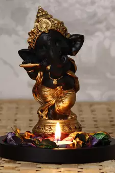 Golden and Black Lord Ganesha Dancing Avatar DECORative Showpiece with Wooden Base  Fragranced Petals and Tealight