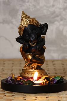 Golden and Black Lord Ganesha Dancing Avatar DECORative Showpiece with Wooden Base  Fragranced Petals and Tealight