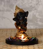 Golden and Black Lord Ganesha Dancing Avatar DECORative Showpiece with Wooden Base  Fragranced Petals and Tealight