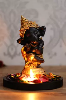 Golden and Black Lord Ganesha Dancing Avatar DECORative Showpiece with Wooden Base  Fragranced Petals and Tealight