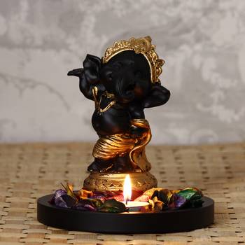Golden and Black Lord Ganesha Dancing Avatar DECORative Showpiece with Wooden Base  Fragranced Petals and Tealight 1