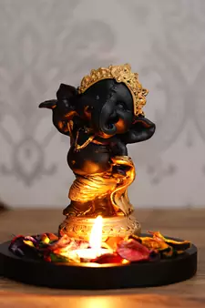 Golden and Black Lord Ganesha Dancing Avatar DECORative Showpiece with Wooden Base  Fragranced Petals and Tealight