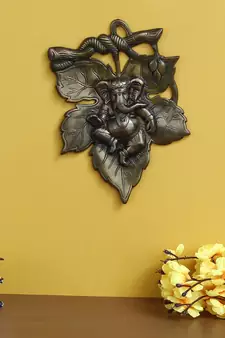 eCraftIndia Antique Finish Lord Ganesha on Creative Leaf Handcrafted Metal Wall Hanging