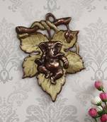 eCraftIndia Golden Finish Lord Ganesha on Creative Leaf Handcrafted Metal Wall Hanging