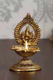 eCraftIndia Lord Ganesha with Diya Handcrafted Golden Metal Showpiece