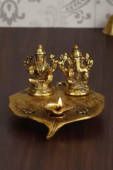 eCraftIndia Golden Laxmi Ganesha with Diya on Leaf Handcrafted Metal Showpiece