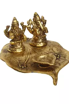 eCraftIndia Golden Laxmi Ganesha with Diya on Leaf Handcrafted Metal Showpiece