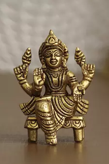 eCraftIndia Goddess Laxmi on Chowki Handcrafted Brass Figurine