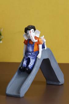 eCraftIndia Lord Ganesha Enjoying Slide with Mushak Colorful Handcrafted DECORative Figurine