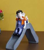 eCraftIndia Lord Ganesha Enjoying Slide with Mushak Colorful Handcrafted DECORative Figurine