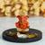 Gold Plated Orange Siddhivinayaka Ganesha DECORative Showpiece with Wooden Base  Fragranced Petals and Tealight