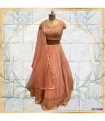 Embroidered blouse with peach lehenga