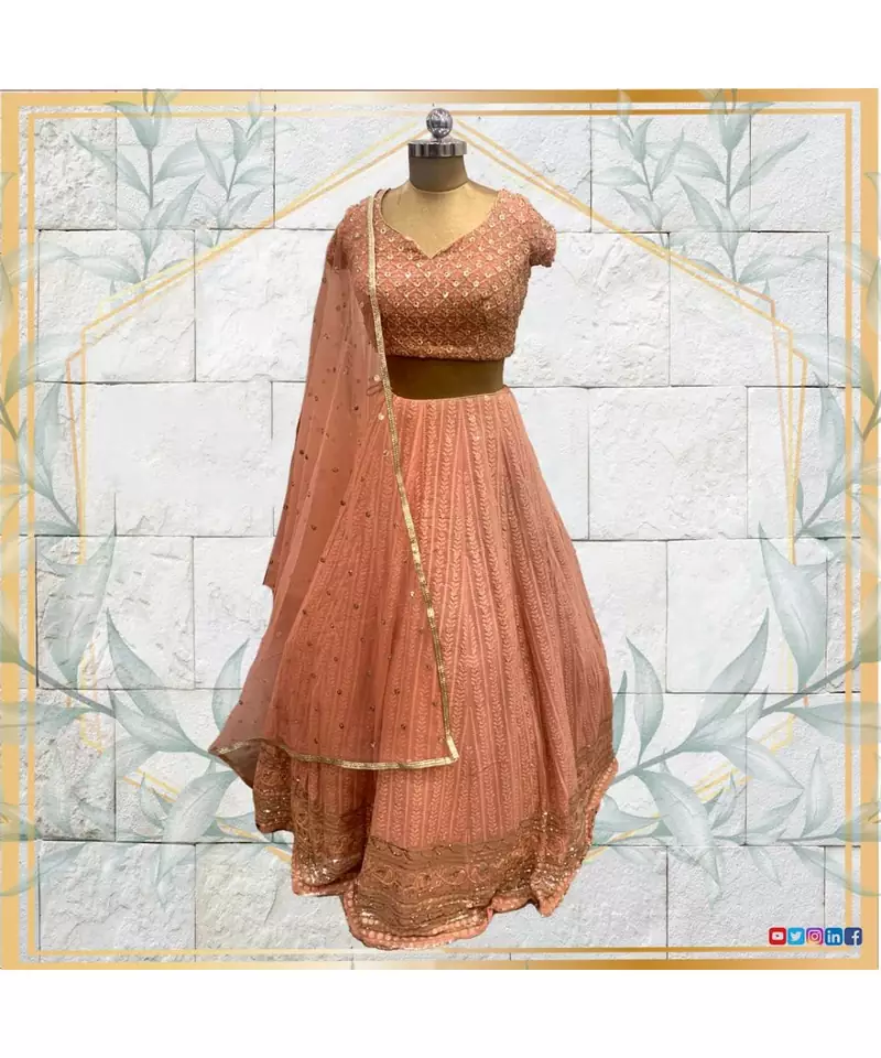 Embroidered blouse with peach lehenga