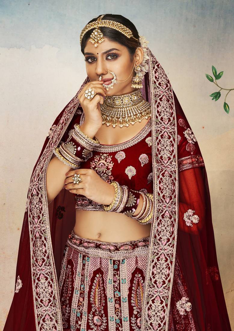 Maroon Thread, dori, zari, and sequins embroidered velvet bridal lehenga choli