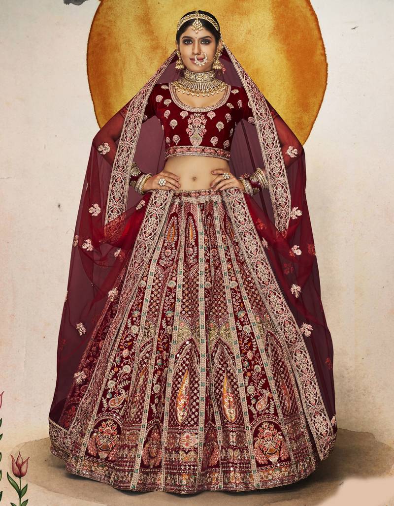 Maroon Thread, dori, zari, and sequins embroidered velvet bridal lehenga choli