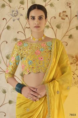 Yellow embroidered organza saree with blouse 2