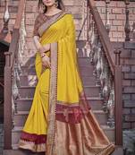 Yellow embroidered georgette saree with blouse