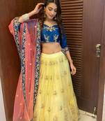 yellow embroidered net semi stitched lehenga
