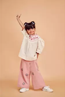 red COTTON ANIMAL EMB FLARED PANTS