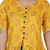 YELLOW PRINTED PEPLUM TOP WITH SKIRT AND POTLI