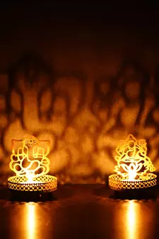 Set of  Ganesha and Laxmi Shadow Tea Light Holder