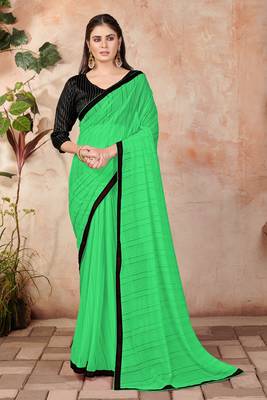 Green plain lycra saree with blouse 1