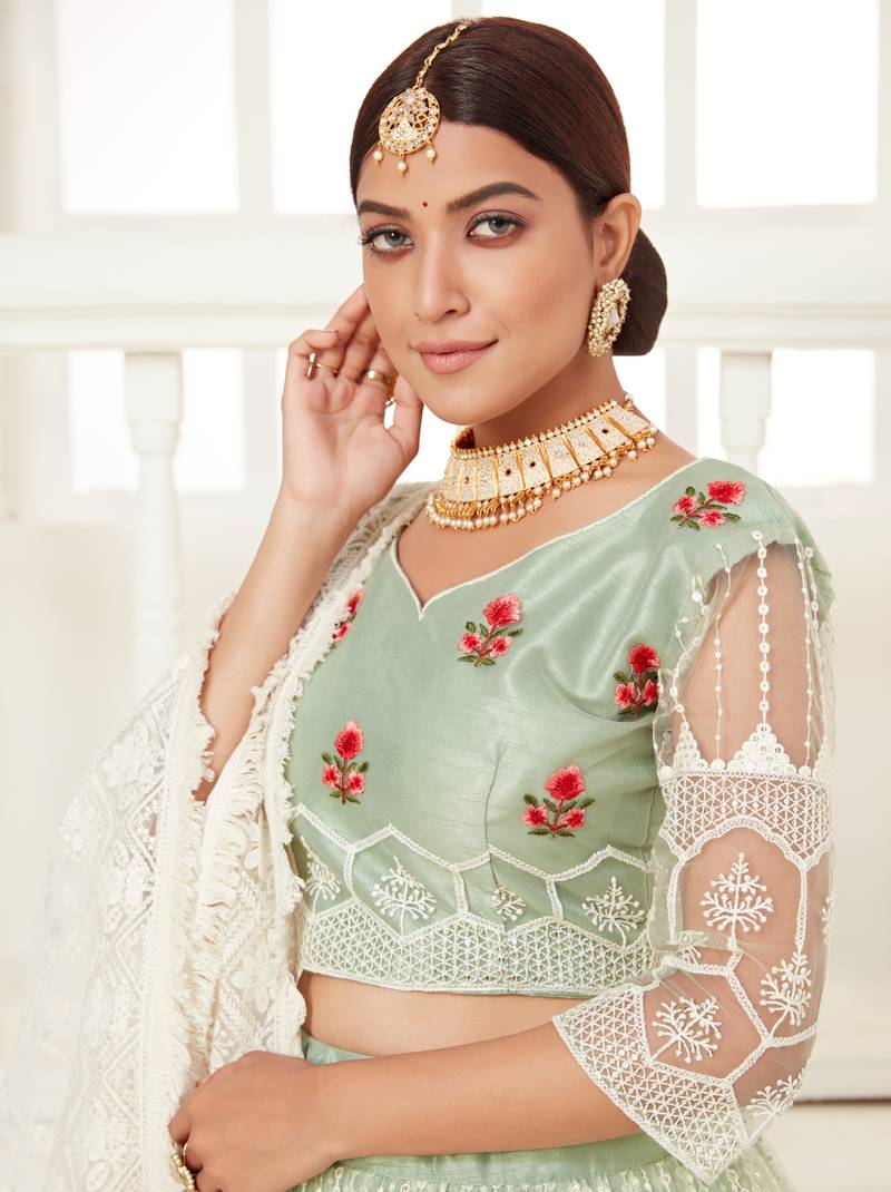 Glamorous Pista Green colored thread with sequins embroidered Heavy Non-non Net Bridal Lehenga choli