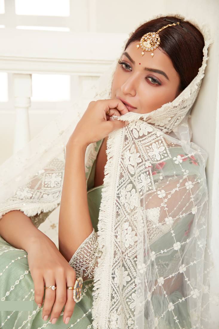 Glamorous Pista Green colored thread with sequins embroidered Heavy Non-non Net Bridal Lehenga choli