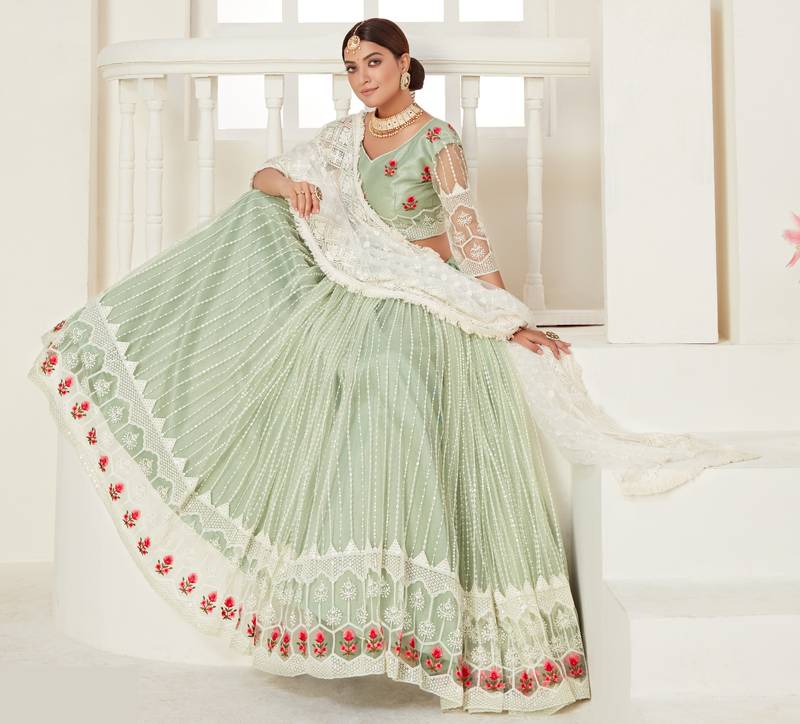 Glamorous Pista Green colored thread with sequins embroidered Heavy Non-non Net Bridal Lehenga choli