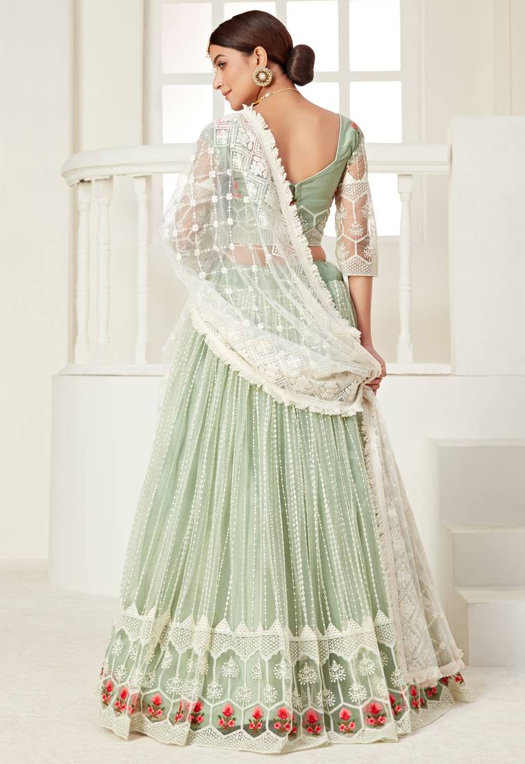 Glamorous Pista Green colored thread with sequins embroidered Heavy Non-non Net Bridal Lehenga choli