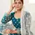 Graceful Teal Green colored thread with sequins embroidered Heavy Non-non Net fabric Lehenga designs
