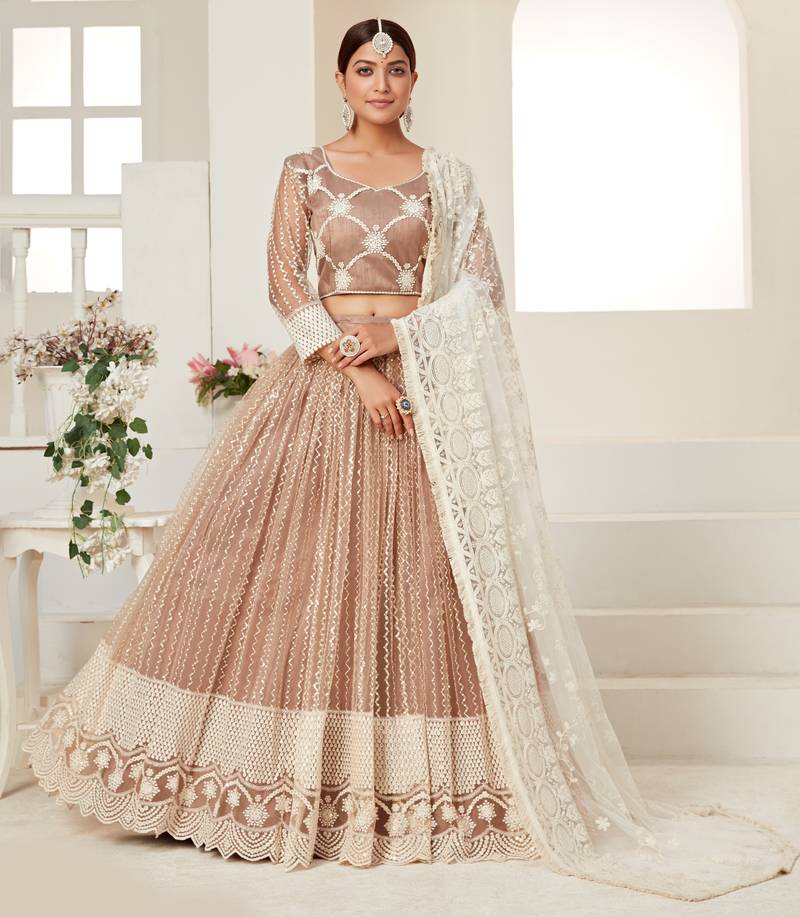 Seductive Beige colored thread with sequins embroidered Heavy Non-non Net Wedding Lehenga choli