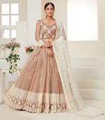 Seductive Beige colored thread with sequins embroidered Heavy Non-non Net Wedding Lehenga choli