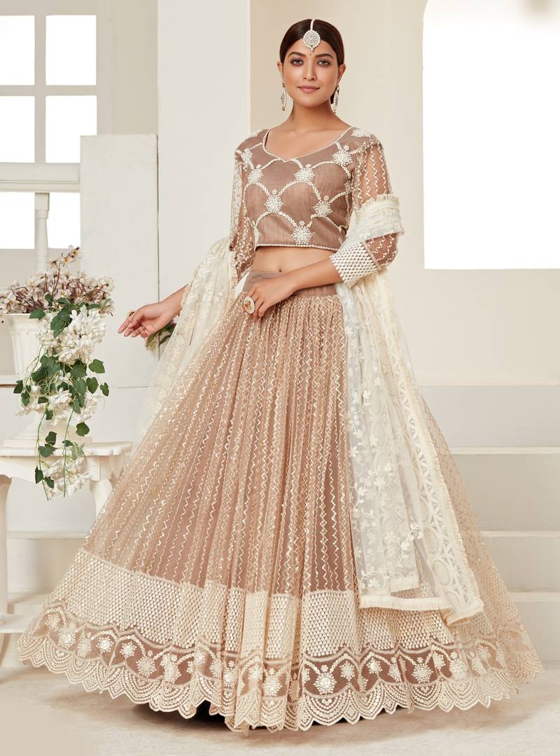 Seductive Beige colored thread with sequins embroidered Heavy Non-non Net Wedding Lehenga choli