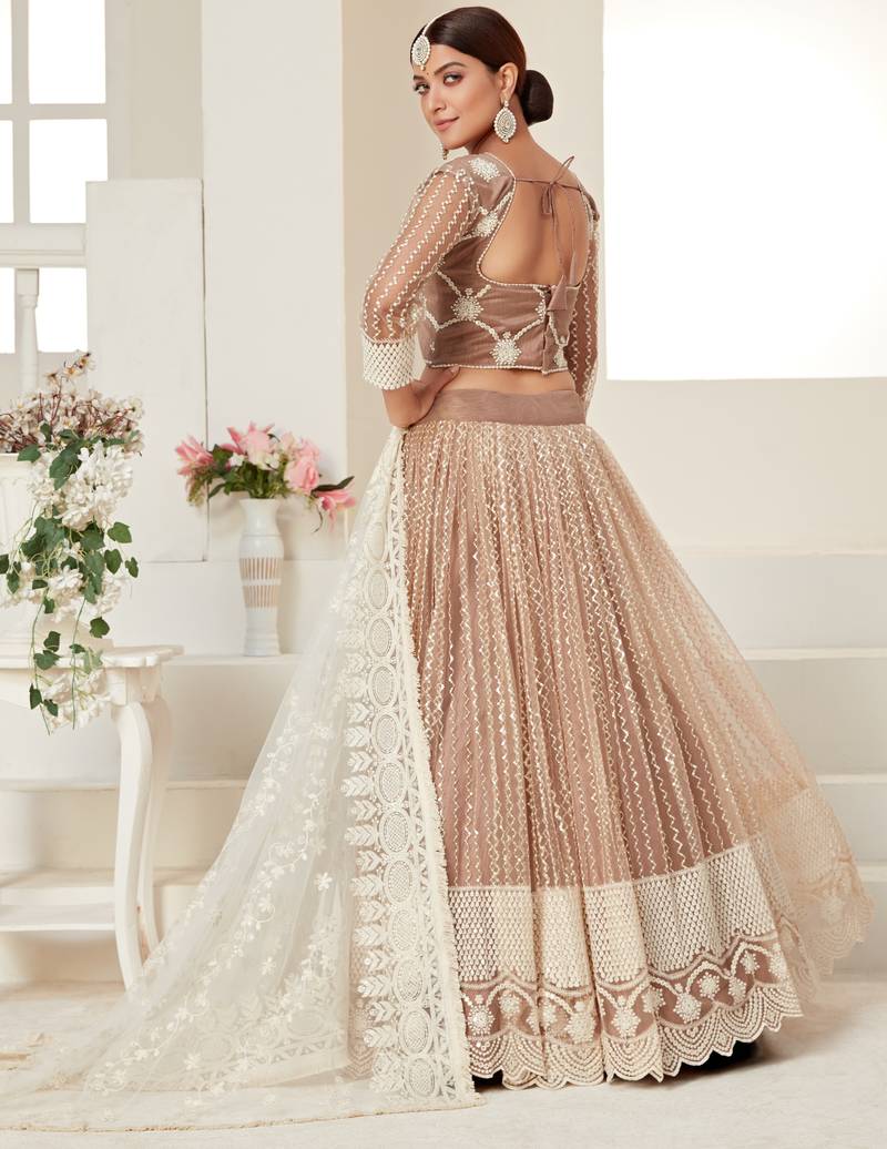 Seductive Beige colored thread with sequins embroidered Heavy Non-non Net Wedding Lehenga choli
