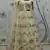 Beige Multi-thread, Sequins & gota patti Embroidered with all over diamond pasting Georgette Semi-stitched Lehenga