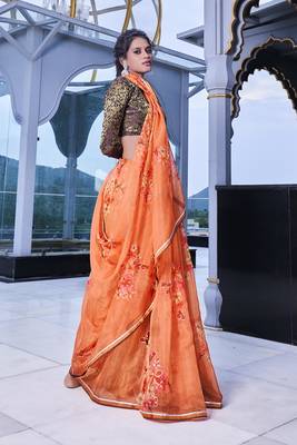Orange printed organza saree with blouse 4
