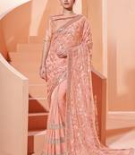 Peach embroidered lycra saree with blouse