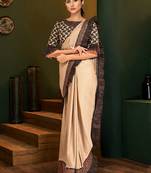 Beige embroidered lycra saree with blouse