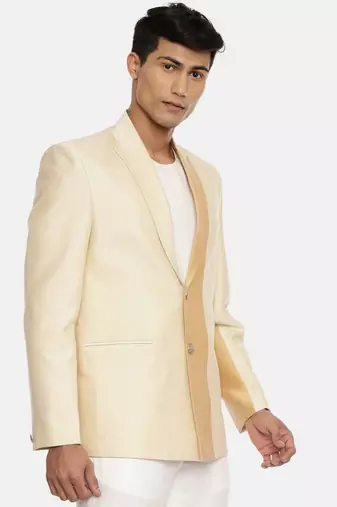 gold beige two button blazer for a sangeet evening . pair with ivory pants to complete the look.
