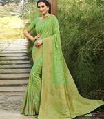 Green woven banarasi silk saree with blouse