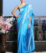 Sky blue silk saree with golden border and buti