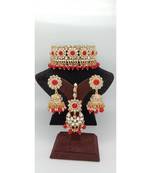 Gold Plated choker set with earrings and Maangtikka in Red color