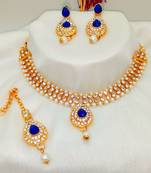 Gold plated jewelry set with earrings and Maangtikka in Blue color