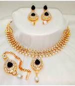 Gold plated jewelry set with earrings and Maangtikka in Black color